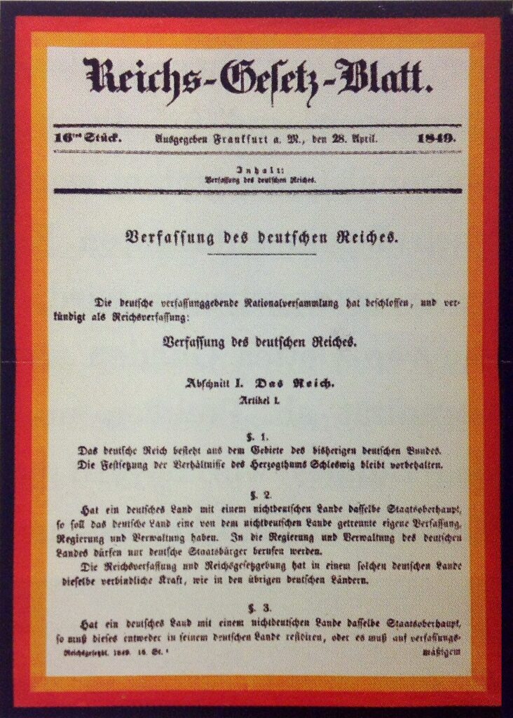 Titelseite des „Reichs-Gesetz-Blatt.“ von 1849 mit der Überschrift „Verfassung des deutschen Reiches“ und dem Text der Artikel 1 bis 3 auf weißem Grund.